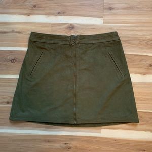 Dark green polyester skirt. Zipper front.
